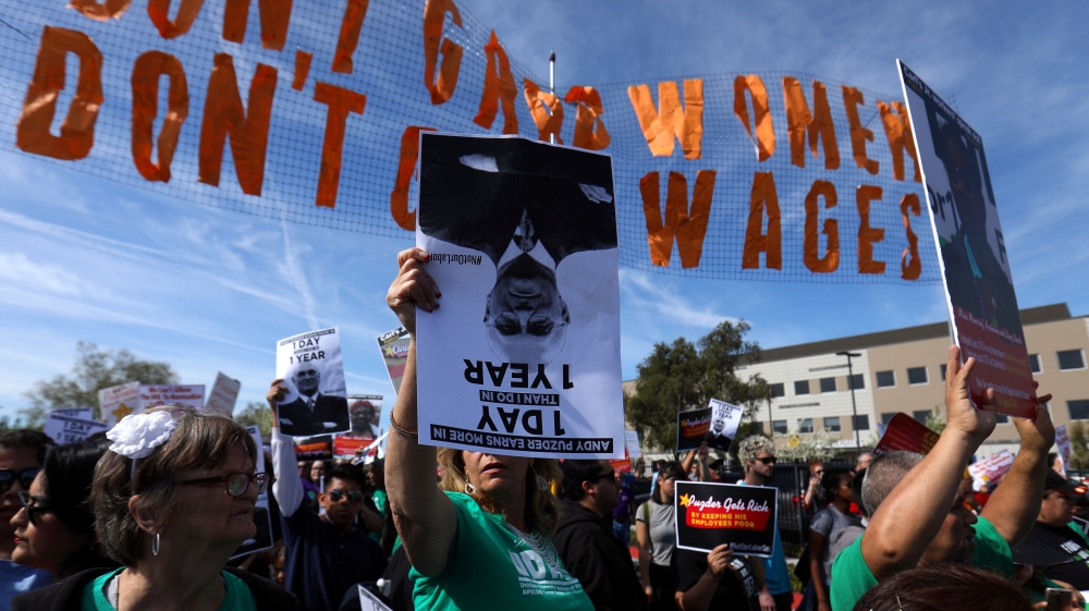 Fast food workers gather outside the corporate offices of Carl Karcher Enterprise, parent company of Carl''s Jr. and Hardee''s restaurants, as they protest against the possible confirmation of company C