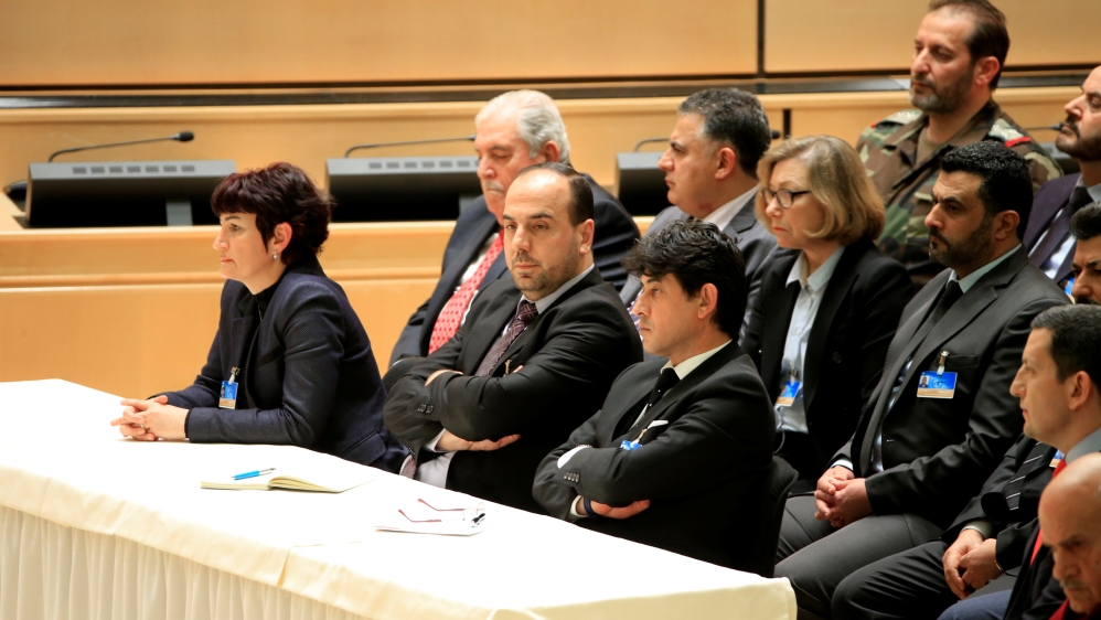 Head of opposition delegation al-Hariri listens during the speech of United Nations Special Envoy for Syria de Mistura in the context of the resumption of intra-Syrian talks, in Geneva