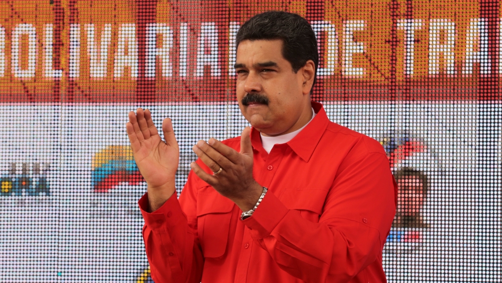 Venezuela''s President Nicolas Maduro applauds as he attends a pro-government rally with workers in Caracas