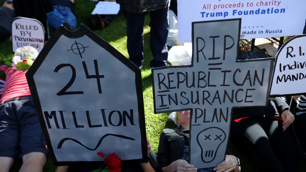Demonstrator lay on the ground during a "die in" protest over the repeal and replacement of Obamacare in Vista
