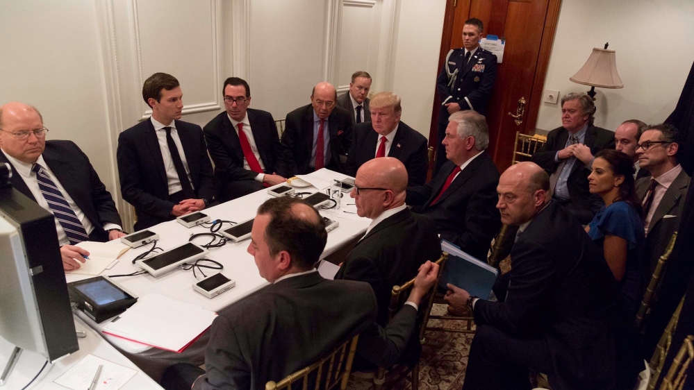 U.S. President Trump is shown in an official White House handout image meeting with his National Security team at his Mar-a-Lago resort after a missile strike on Syria