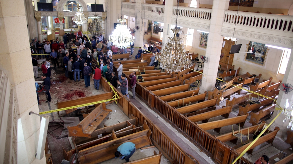 Security personnel secure the scene of the bomb explosion in Mar Girgis church [EPA]