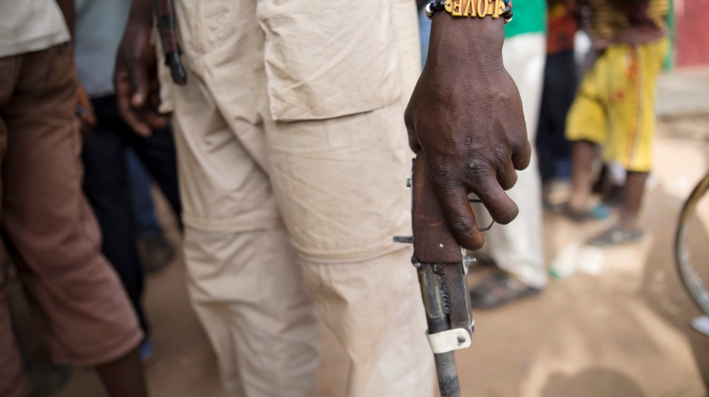 A member of the of the Anti-Balaka armed militia displays his weapon in the town of Bocaranga, Central African Republic