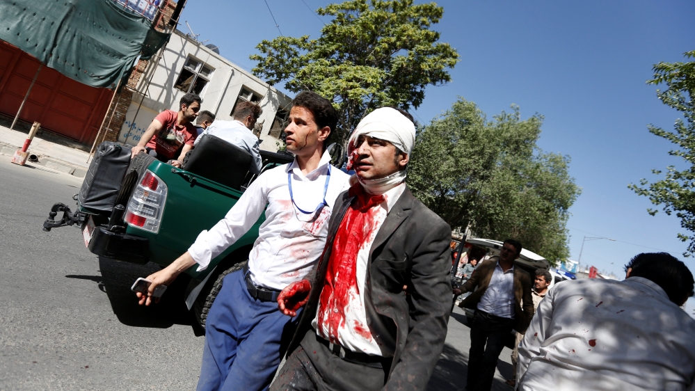 An injured man arrives to a hospital after a blast in Kabul, Afghanistan