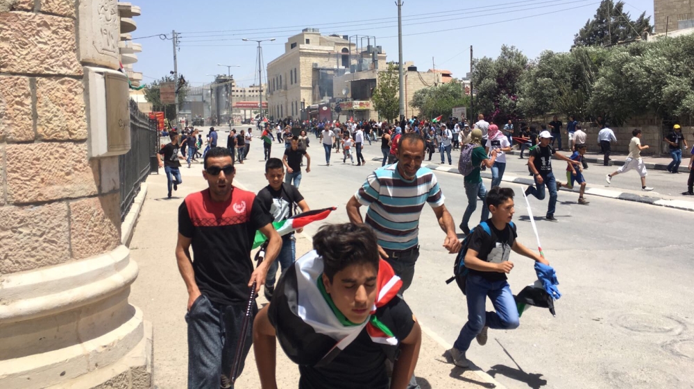 Israeli forces dispersed Nakba demonstrations in Bethlehem by firing tear gas [Teodor Tita/Al Jazeera]