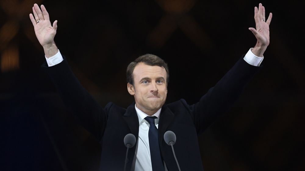 Macron won the vote with 66 percent of the total ballots cast [Eric Feferberg/AFP]
