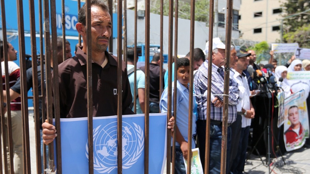 Man plays the role of a prisoner during a protest in support of Palestinian prisoners on hunger strike in Israeli jails, in Gaza City