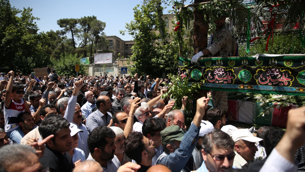 People attend the funeral of the victims who were killed on the June 7 attack at the Iranian parliament and Ayatollah Khomeini''s mausoleum, in Tehran