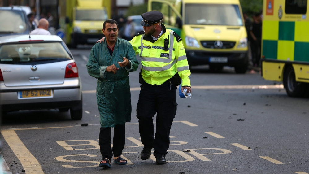 Police evacauted people from inside and around the Grenfell Tower building [Reuters]