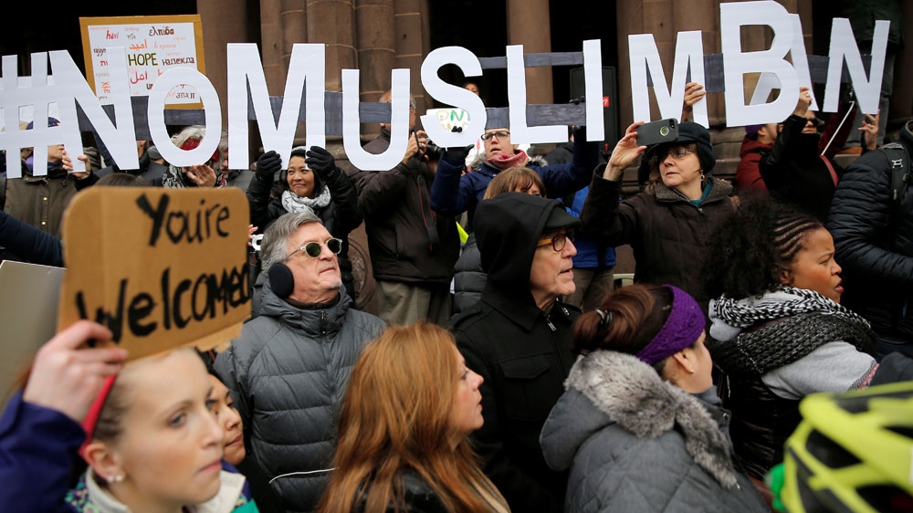 Demonstrators spell out “# No Muslim Ban” during the “Boston Protest Against Muslim Ban and Anti-Immigration Orders”