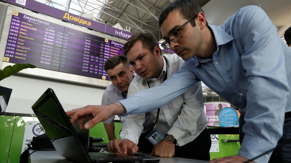 Technicians work on a flight timetable for the airport''s site at the capital''s main airport, Boryspil, outside Kiev