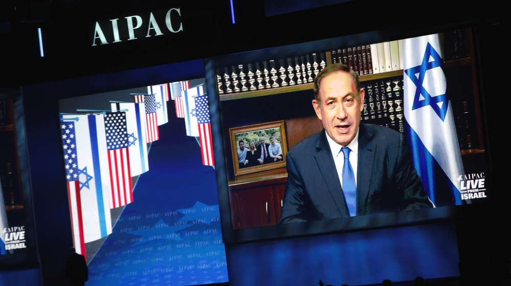 Israeli Prime Minister Benjamin Netanyahu speaks via a video link from Israel to the AIPAC conference in 2017