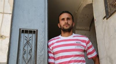 Hazem Abu Rajab says his family cannot leave their home, for fear that settlers will occupy it [Mersiha Gadzo/Al Jazeera]
