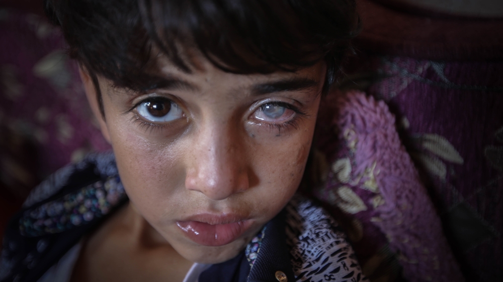 'Wherever I go, Amir stays by my side, like a child of two years old,' says Ibtisam [Ezz Zanoun/Al Jazeera]