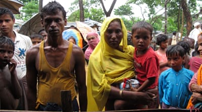 On September 27, this couple was reunited with their son in Kutupalong registered refugee camp at a booth that helps locate missing family members [Annette Ekin/Al Jazeera]
