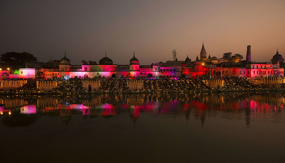 Devotees light earthen lamps on the banks of the River Sarayu as part of Diwali celebrations in Ayodhya, India, Wednesday, Oct. 18, 2017. Ayodhya is believed to be the birthplace of Hindu God Rama and