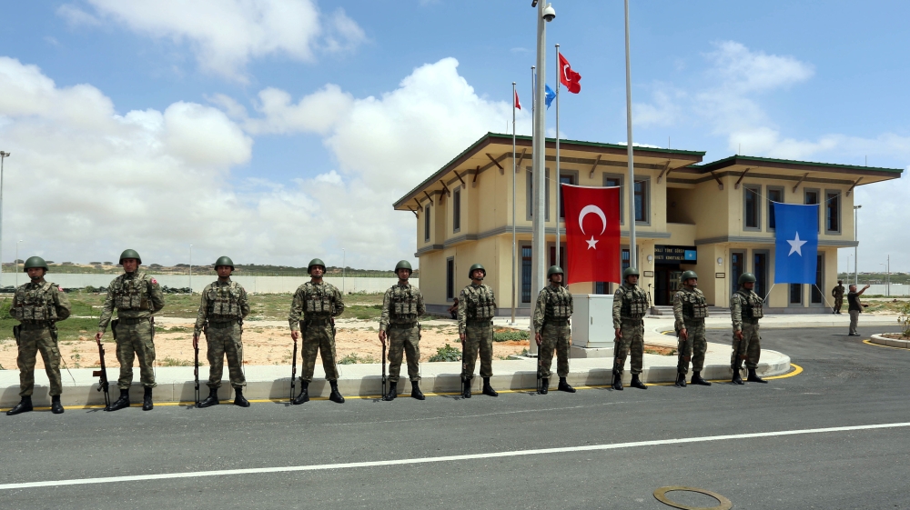 Turkish military officers parade during the opening ceremony of a Turkish military base in Mogadishu