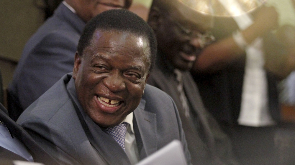 Zimbabwe Vice-President Mnangagwa listens as President Robert Mugabe delivers his state of the nation address to the country''s parliament in Harare