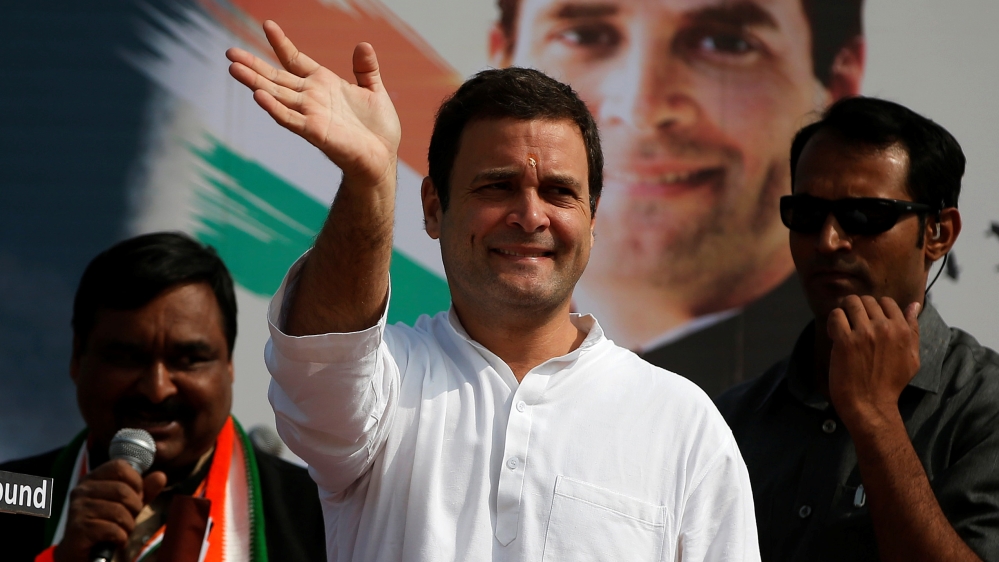 Rahul Gandhi, Vice-President of India''s main opposition Congress Party, waves to his supporters during a rally ahead of Gujarat state assembly elections, at a village on the outskirts of Ahmedabad