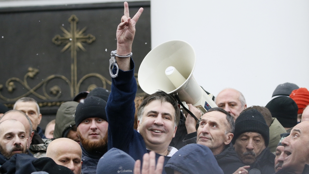 Georgian former President Mikheil Saakashvili flashes a victory sign after he was freed by his supporters in Kiev, Ukraine December 5, 2017. REUTERS/Gleb Garanich TPX IMAGES OF THE DAY