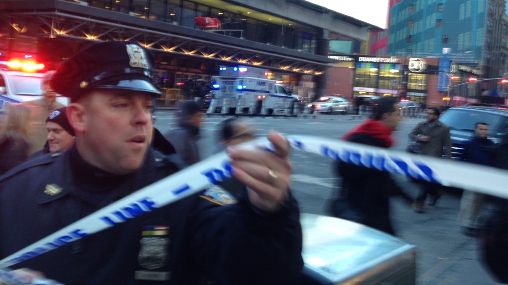 Police respond to a report of an explosion near Times Square on Monday, Dec. 11, 2017, in New York. (AP Photo/Charles Zoeller)