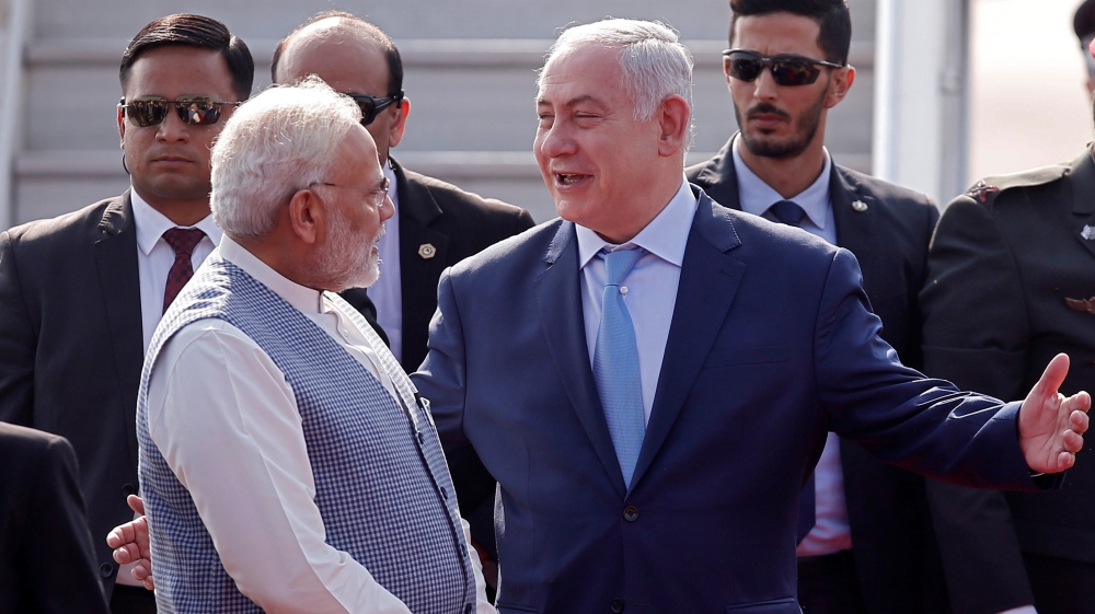 Israeli Prime Minister Benjamin Netanyahu is welcomed by his Indian counterpart Narendra Modi upon his arrival at Air Force Station Palam in New Delhi