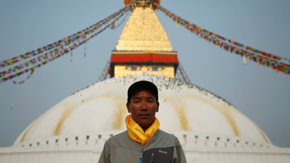 Kami Rita Sherpa, 48, who is attempting a world record by climbing Mount Everest for the 22nd time this season, poses for a picture at Boudhanath Stupa in Kathmandu