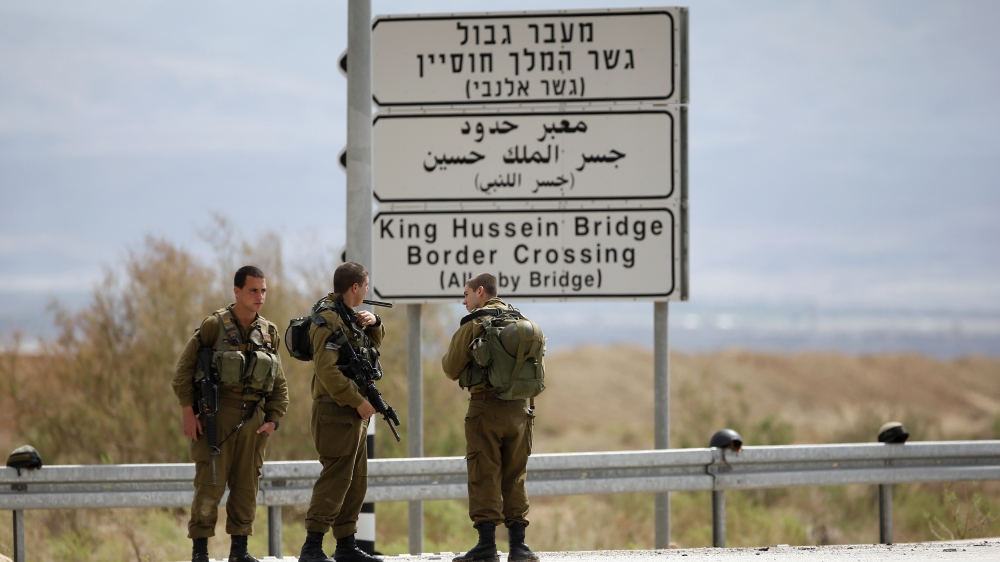 Israeli soldiers stand guard near the entrance to Allenby Bridge, a crossing point between Jordan and the occupied West Bank, near Jericho