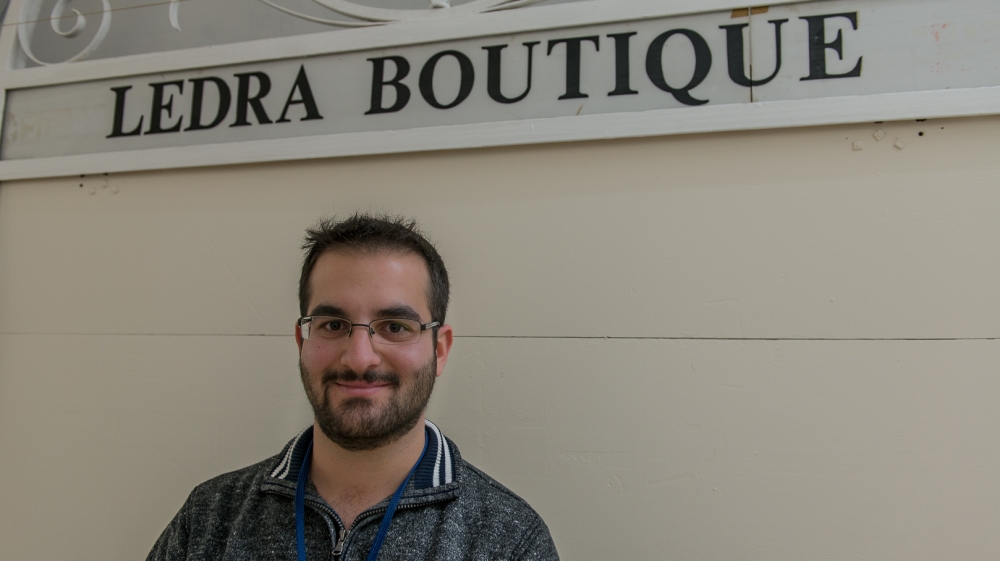 Orestis Agisilaou, 23, is the choir's youngest member [Dimitris Sideridis/Al Jazeera]