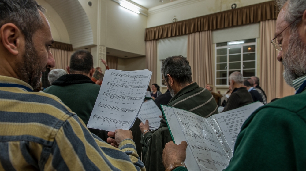 The repertoire comprises songs in multiple languages that speak of love and peace [Dimitris Sideridis/Al Jazeera]