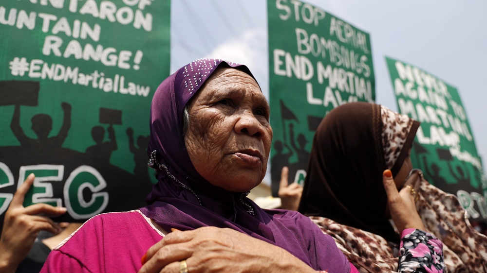 Activists have demanded that President Duterte end martial law in Mindanao [EPA]