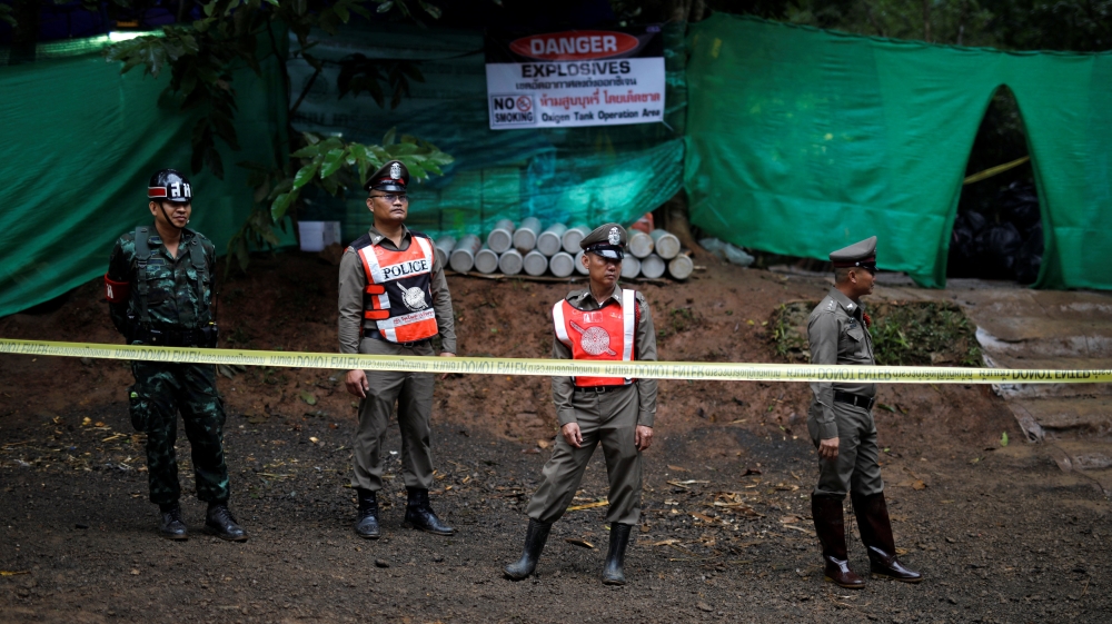 Police stand guard outside the Tham Luang cave complex after Thailand''s government instructed members of the media to move out urgently, in the northern province of Chiang Rai