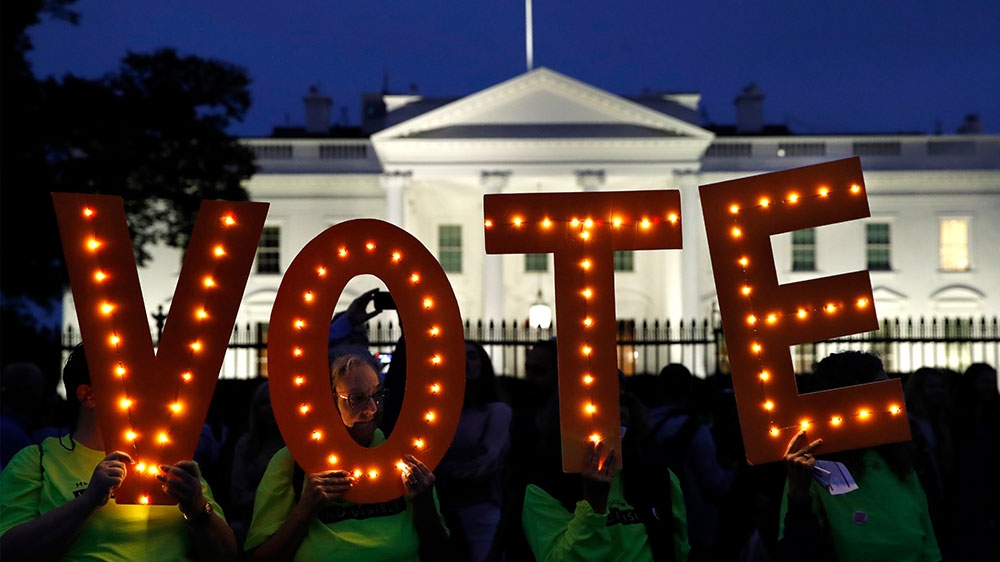 Those opposed to the confirmation of Supreme Court Justice Brett Kavanaugh vowed to move their fight to the November midterms [File: Jacquelyn Martin/AP Photo] 