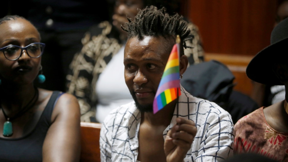 An LGBT activist holds the rainbow flag during a court hearing in the Milimani high Court in Nairobi in Nairobi