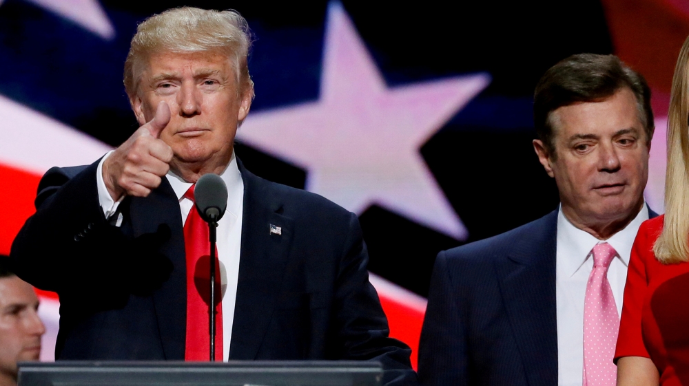 FILE PHOTO: FILE PHOTO: Then-Republican presidential nominee Donald Trump gives a thumbs up as his campaign manager Paul Manafort looks on during Trump''s walk through at the Republican National Conven
