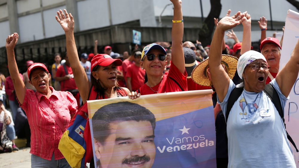  Government supporters are seen in the streets [AFP]