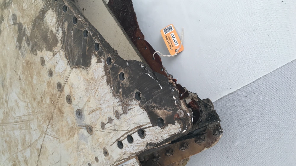 Three pieces of wreckage from MH370, including this one found on a beach off Tanzania, have been recovered since it went missing [Kate Mayberry/Al Jazeera]