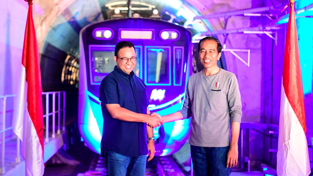 Indonesia''s President Joko Widodo (R) shakes hands with Governor of Jakarta Anies Baswedan (L) during Jakarta Mass Rapid Transit (MRT) first-phase launching at Bundaran HI station in Jakarta