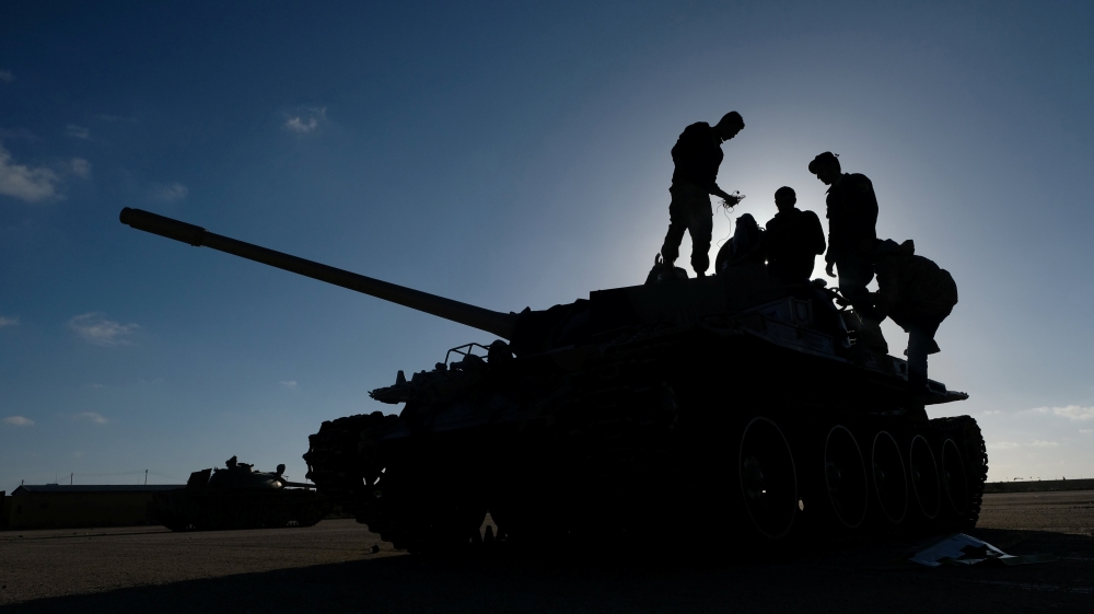 Members of Libyan National Army (LNA) commanded by Khalifa Haftar, get ready before heading out of Benghazi to reinforce the troops advancing to Tripoli, in Benghazi