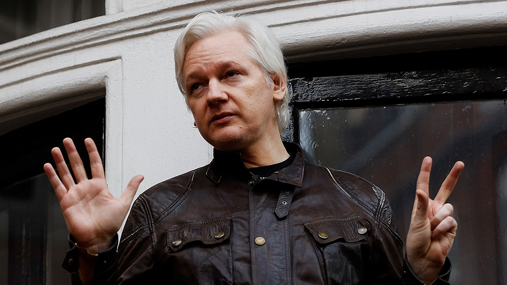 FILE - WikiLeaks founder Julian Assange is seen on the balcony of the Ecuadorian Embassy in London, Britain, May 19, 2017. REUTERS/Peter Nicholls TPX IMAGES OF THE DAY -