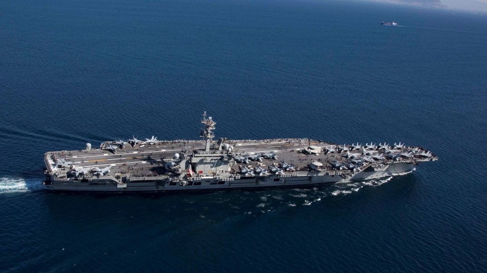 The Nimitz-class aircraft carrier USS Abraham Lincoln (CVN 72) transits the Strait of Gibraltar, entering the Mediterranean Sea