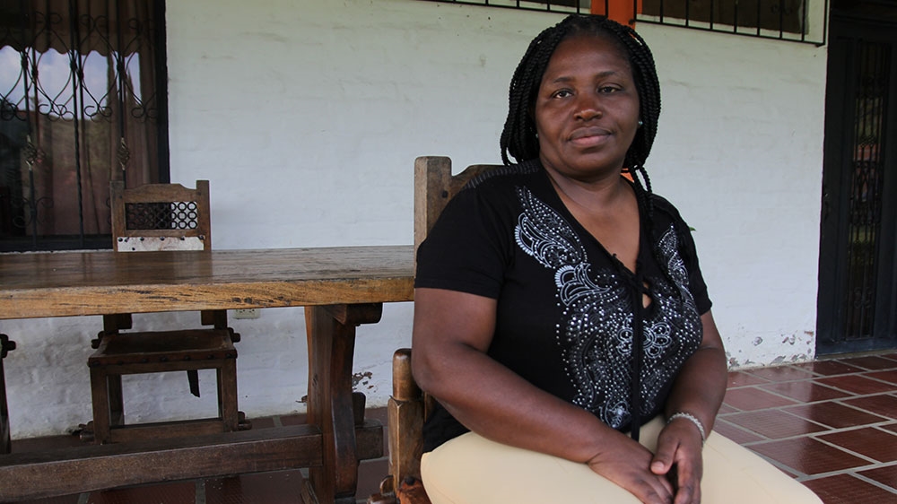 Clemencia Carabali poses for a photograph as she takes a break between meetings, discussing women and Afro-Colombian rights, in the town of Santander de Quilochao, Colombia [Kimberley Brown/Al Jazeera] 