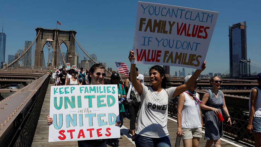 Demonstrators march on Brooklyn Bridge during ‘Keep Families Together’ march to protest Trump administration’s immigration policy in New York