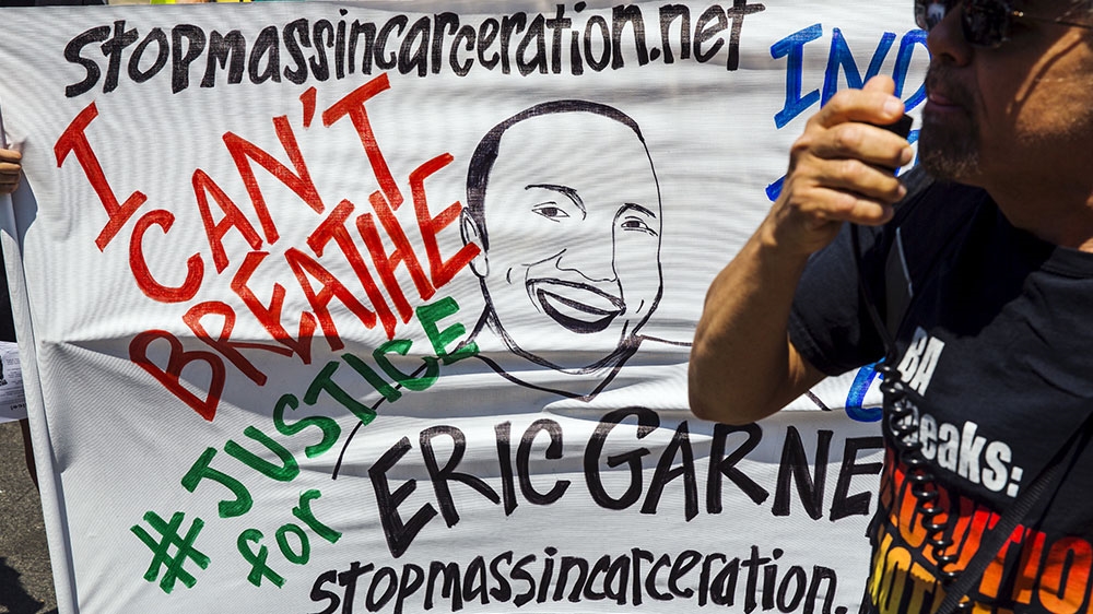 Protesters rally and speak out on the one-year anniversary of the death of Eric Garner in New York