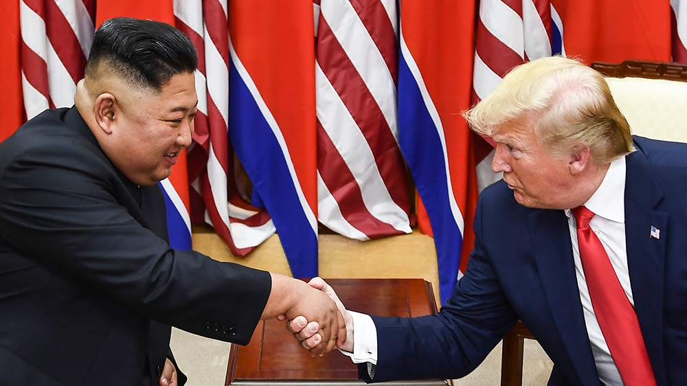 North Korea''s leader Kim Jong Un (L) and US President Donald Trump shake hands during a meeting on the south side of the Military Demarcation Line that divides North and South Korea, in the Joint Secu