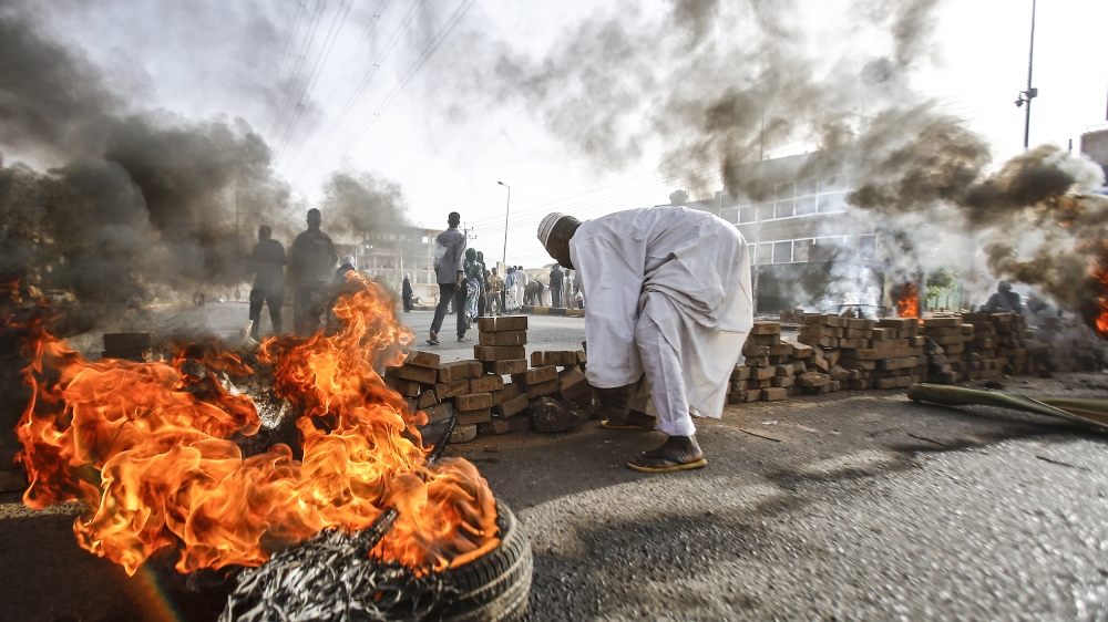 Sudanese protesters close Street 60 with burning tyres and pavers as military forces tried to disperse a sit-in outside Khartoum''s army headquarters on June 3, 2019. At least two people were killed Mo