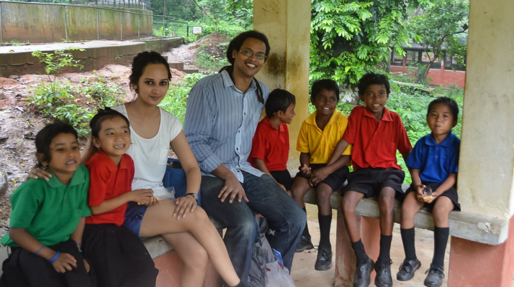 The founders, Parmita Sarma (left) and her husband Mazin Mukhtar with a group of pupils [Courtesy of Akshar Forum]