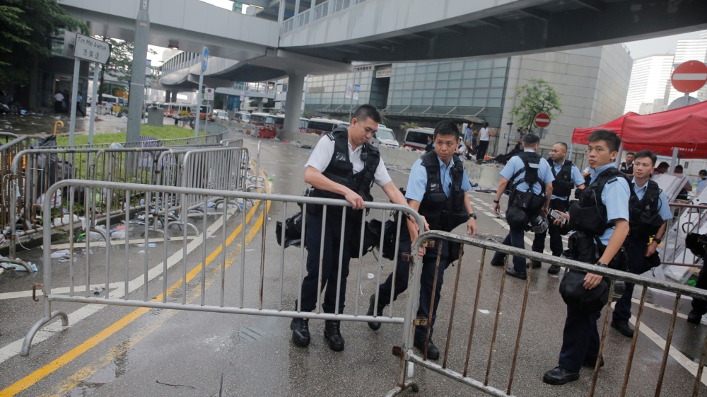 Police close a barrier surrounding the Legislative Council building