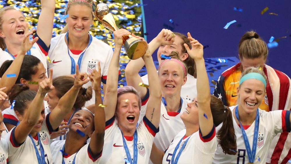 Soccer Football - Women''s World Cup Final - United States v Netherlands - Groupama Stadium, Lyon, France - July 7, 2019 Megan Rapinoe of the U.S. lifts the trophy as she celebrates winning the Women''s