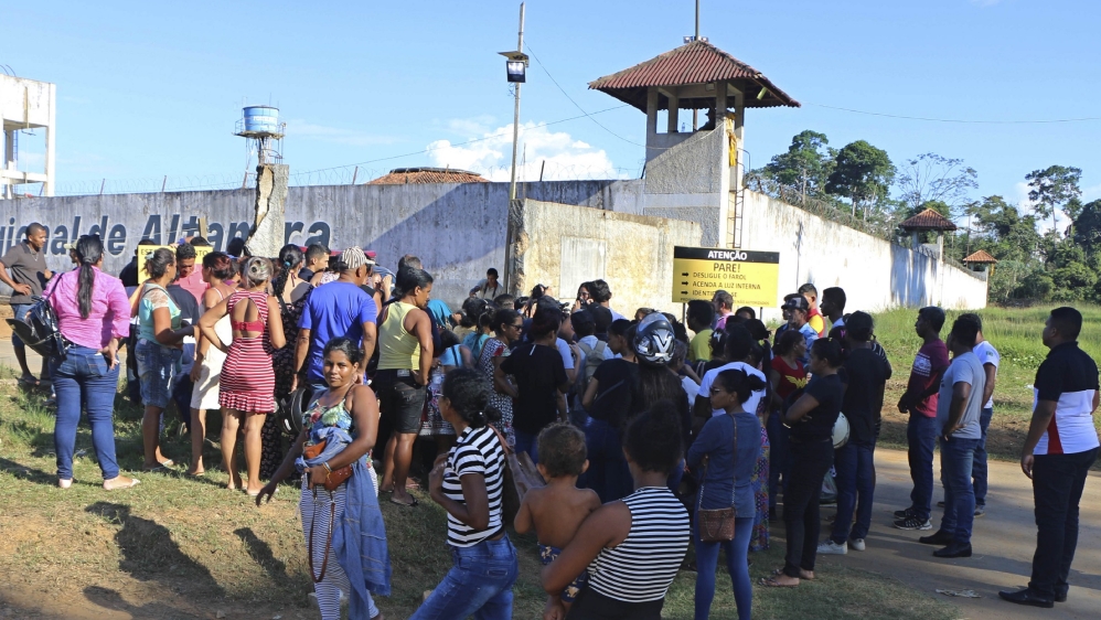 People seek information about family members who are prisoners after a riot inside the Regional Recovery Center in Altamira